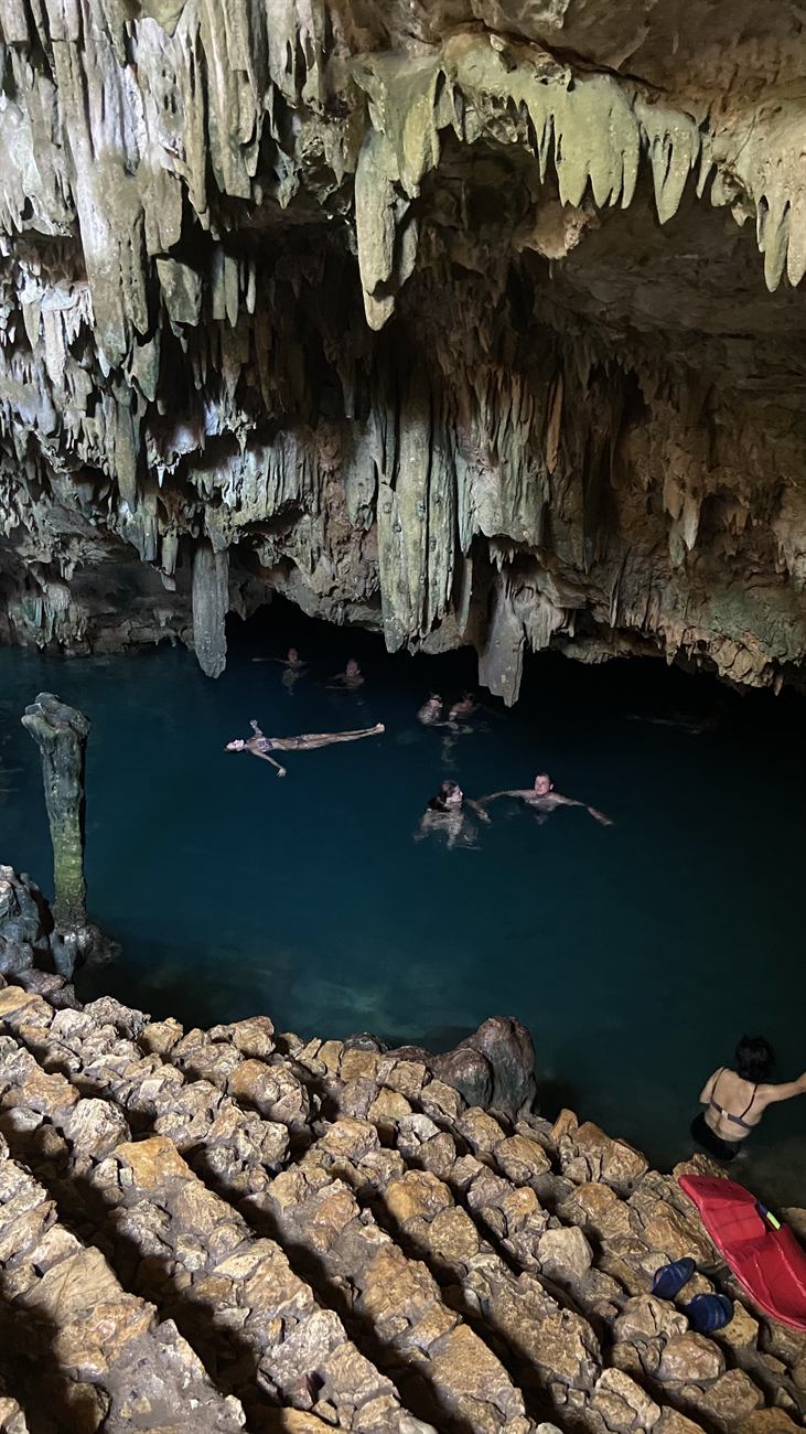 Turquoise water and limestone walls inside Rangko Cave near Labuan Bajo